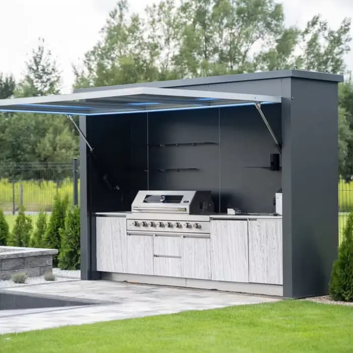 Cabane de barbecue moderne préfabriquée avec gril central, table à manger, bancs et cheminée pour fê